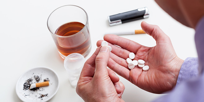 Why do people self-medicate with alcohol and drugs?